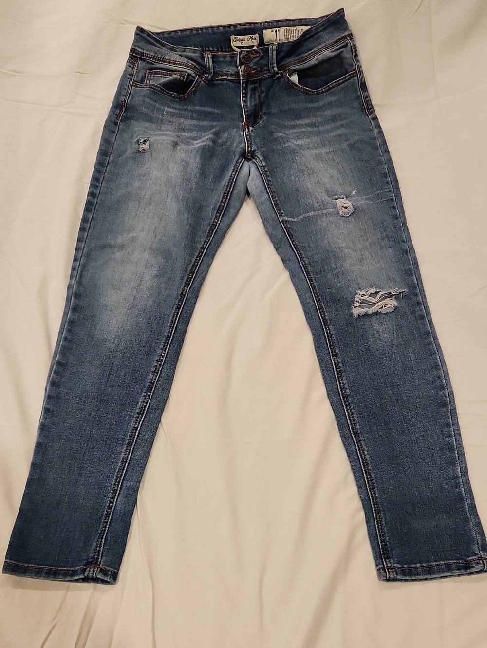 Size 11 Indigo Rein Women's Light Blue Skinny Jeans with Distressed Details